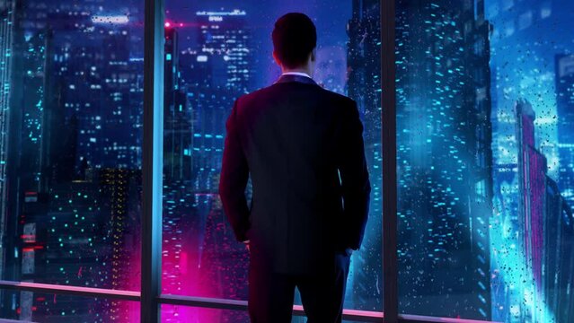 In the near future, thoughtful Businessman wearing a suit standing in his office, looking out of the window and staring at a futuristic city with skyscrapers and colorful lights.