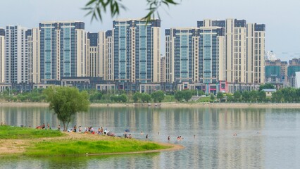 Mudanjing, Heilongjiang, China - June 23 2021: A modern apartment by the river