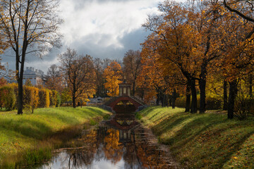 Cross bridge (Krestovy bridge) in the Alexander Park of Tsarskoye Selo on a sunny autumn day,...