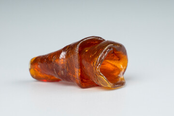 a piece fragrant amber terpy live resin for smoking cannabis, shatter wax weed with thc content