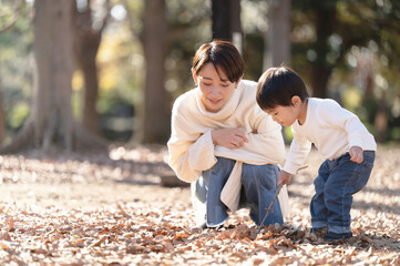 Portrait of mother and child playing in park