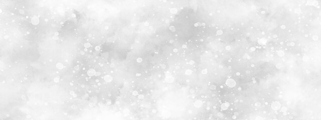flakes falling randomly on clouds, beautiful white watercolor background with glitter particles, white bokeh background for wallpaper, invitation, cover and design.	