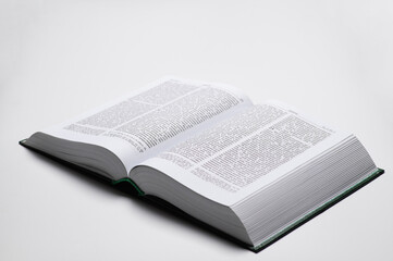 The book of the Bible in the Ukrainian language is open on a white background