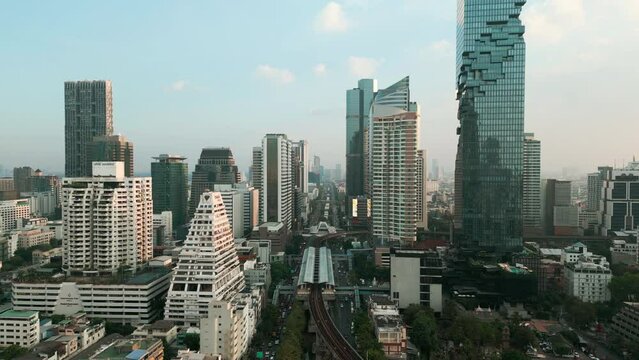Silom Sathorn transport road car with modern office building aerial view Bangkok Thailand
