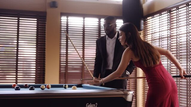 Man Getting Close To The Woman Near The Pool Table
