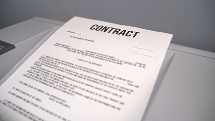 Concept: paper the contract is printed on the printer. Contract comes out of the printer. Contract sent by Fax