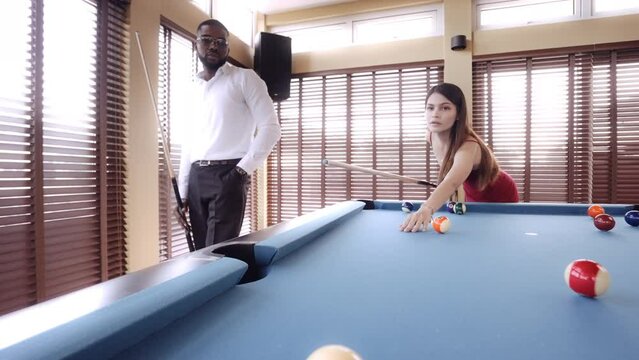 Woman Successfully Pockets Ball In Pool