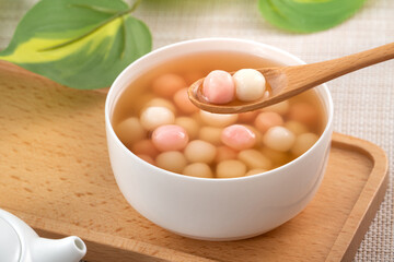 Red and white tangyuan with syrup soup.