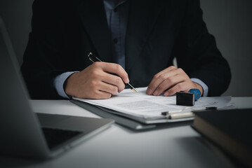 businessman agree to make deal signing document, sale contract or legal transaction contract at desk