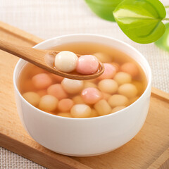 Red and white tangyuan with syrup soup.
