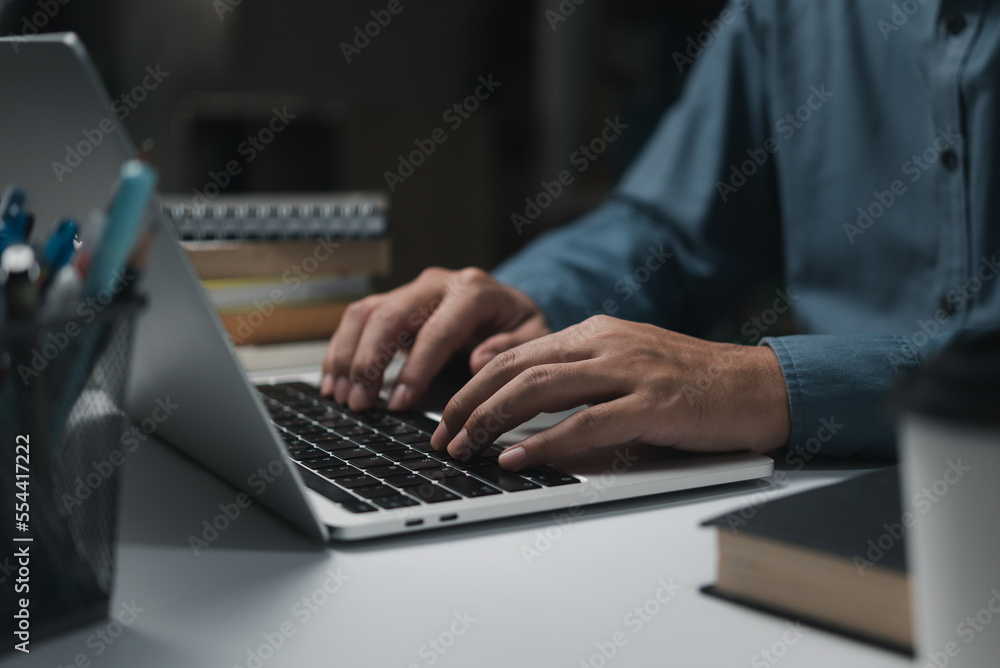 Poster business man hands working and typing message on laptop keyboard on table.concept for technology dev