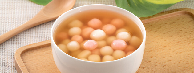 Red and white tangyuan with syrup soup.