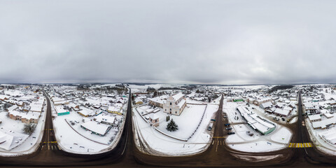 aerial full seamless spherical winter 360 hdri panorama view overlooking small village with church...
