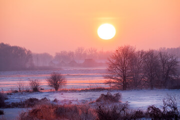 Winter landscape with sunrise, beautifuk warm light, snow