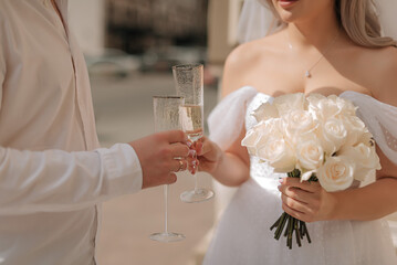 bride and groom with champagne