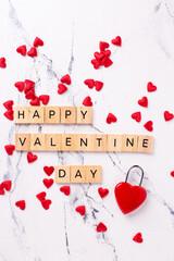 Valentines day postcard. Romantic  layout. Wooden latters, lock in form of heart and little hearts on  white marble background.  Top view. - 554425644