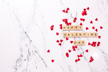 Valentines day postcard. Romantic  layout. Wooden latters on  white marble background.  Top view. Place for text. - 554425664