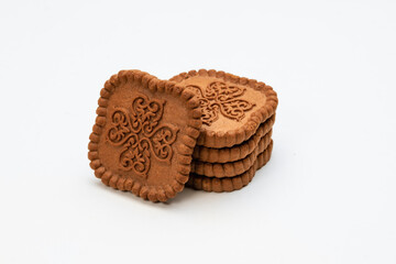 Chocolate color square shaped cookies on a white background