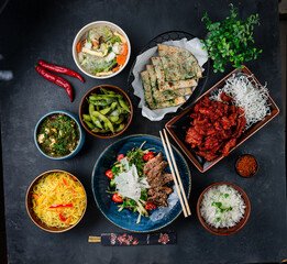 Asian set sweet and sour chicken, chicken noodle soup with mushrooms, rice noodles with vegetables, duck fillet salad, beans, cheese with spinach and spices, cheese and spinach tortillas.