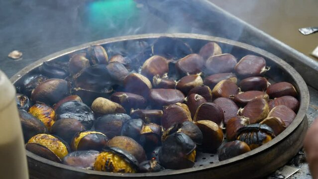 night illuminated istanbul city famous street food fried chestnuts slow motion view 4k turkey