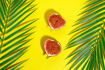 Juicy ripe fruit figs on a yellow background. Diet food. Bright summer concept