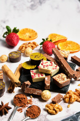a variety of chocolates on a light background