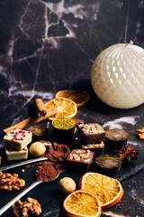 a variety of chocolates on a dark background