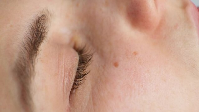 Eyes of a sleeping woman, phases of sleep, phase of rapid eye movement, restless poor sleep, anxiety.