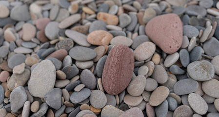 Rounded stones background with different colors, top view