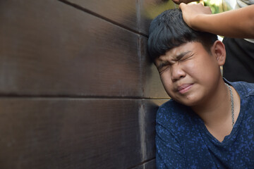 Asian secondary school boy was intimidated by bad habit students at the wall of the bathroom, soft...