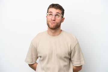 Fototapeta premium Young caucasian man isolated on white background and looking up