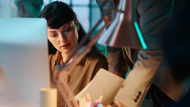 Secretary, receptionist and files at desk from boss in office of corporate business, woman working late at night and planning schedule. Comany employee, management task and creating a work calendar