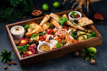 Traditional Russian snack for vodka lard, pork, cucumbers, tomatoes, mushrooms, olives, capers,...