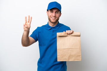 Delivery caucasian man isolated on white background happy and counting three with fingers