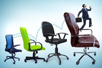 Promotion concept with businessman and chairs