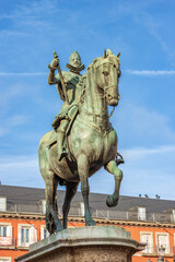 Fototapeta na wymiar Closeup of the bronze statue of King Philip III on Horseback (Felipe III or Felipe el Piadoso), in Plaza Mayor (main square), Madrid downtown, community of Madrid, Spain, southern Europe.