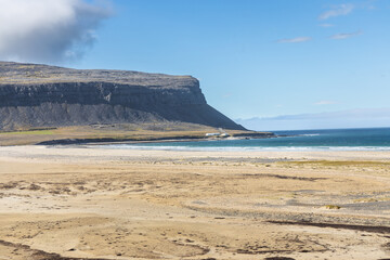 Fototapeta na wymiar Raudasandur beach or Red Sands beach is a beautiful red beach in a very remote area in the Westfjords of Iceland