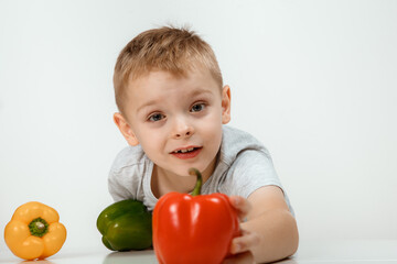 Fototapeta na wymiar Kid girl preparing vegetable. Concept of healthy food.