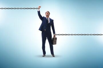 Fototapeta premium Chained businessman in workaholic concept