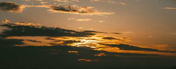 time lapse of clouds over sunset