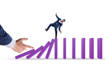 Businessman in domino effect concept