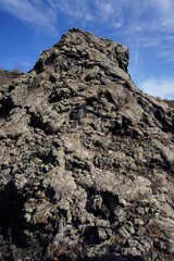 Volcanic landscapes of Lanzarote. Solidified lava, lava chimney, lava tunnel, sea of lava, eruption, canary islands, crater, volcano, black rocks, photographed in November 2022, trekking trip,