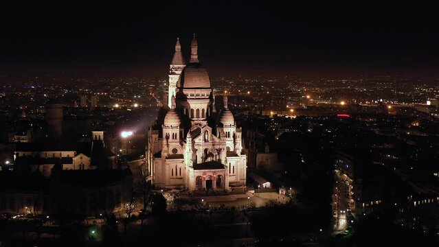 Basilica Montmartre in Paris by night aerial view