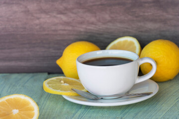 Fresh lemon black coffee in white cup.