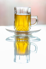 Moroccan tea at the cafe in the glass cup, closeup