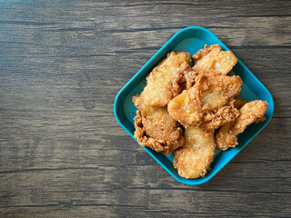 Deep-fried sliced banana ready to eat on the wood background