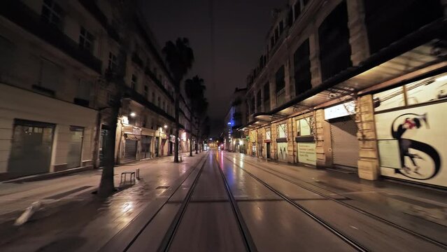 Main street in montpellier by night empty traffic lanes 
