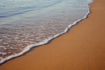 beach in the morning, Sand on the beach with a sea wave. 