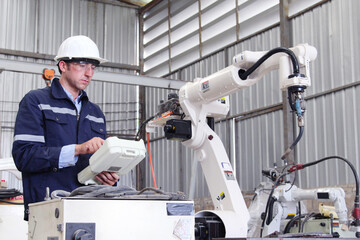 Robot control engineer working industry concept.