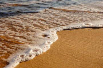 Waves on the beach, Sand on the beach with a sea wave. 